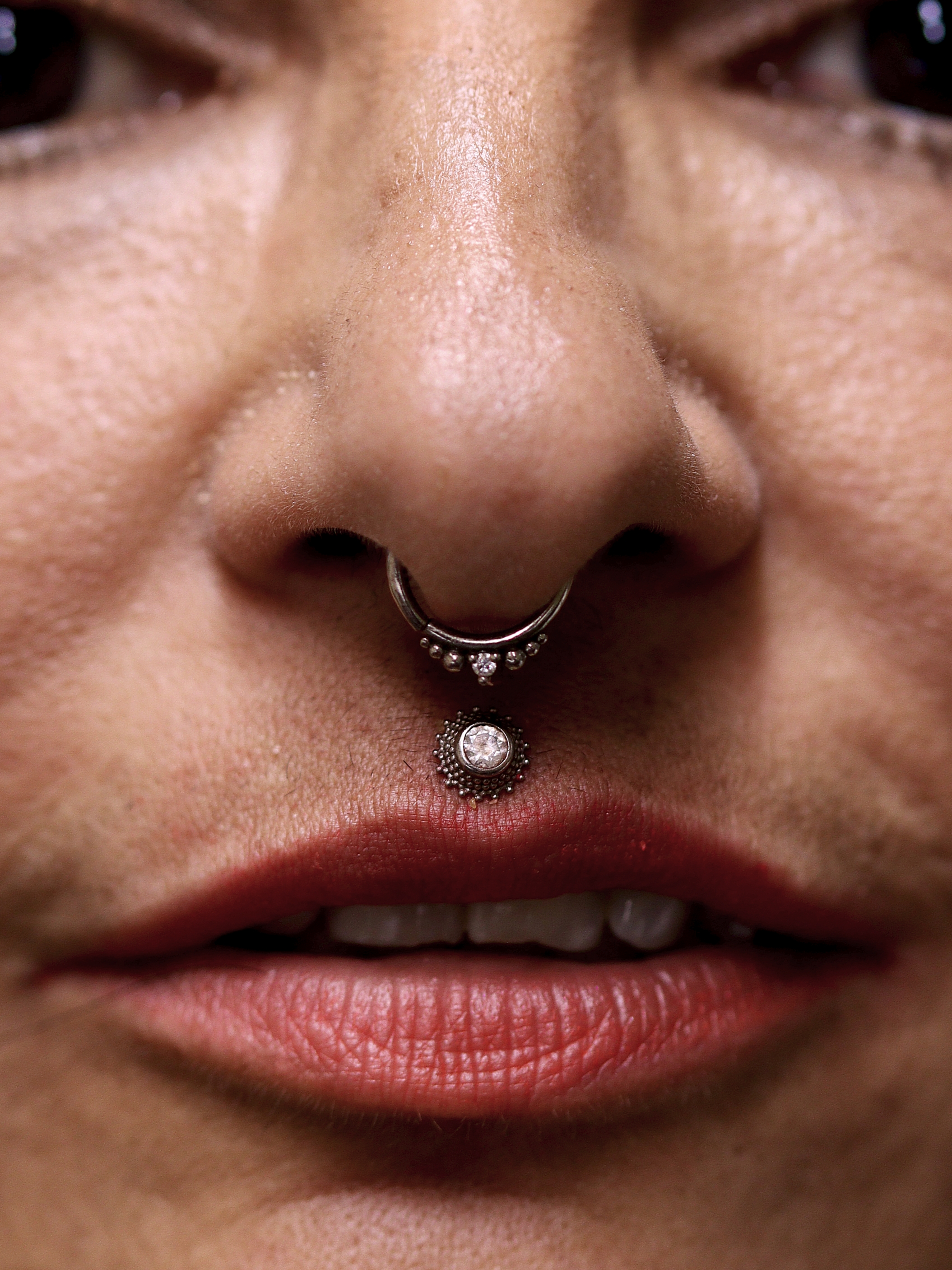Septum and Philtrum piercings with Audition and Immaculate ends from Ixus Fine Jewellery in 18k white gold with moissanite stones