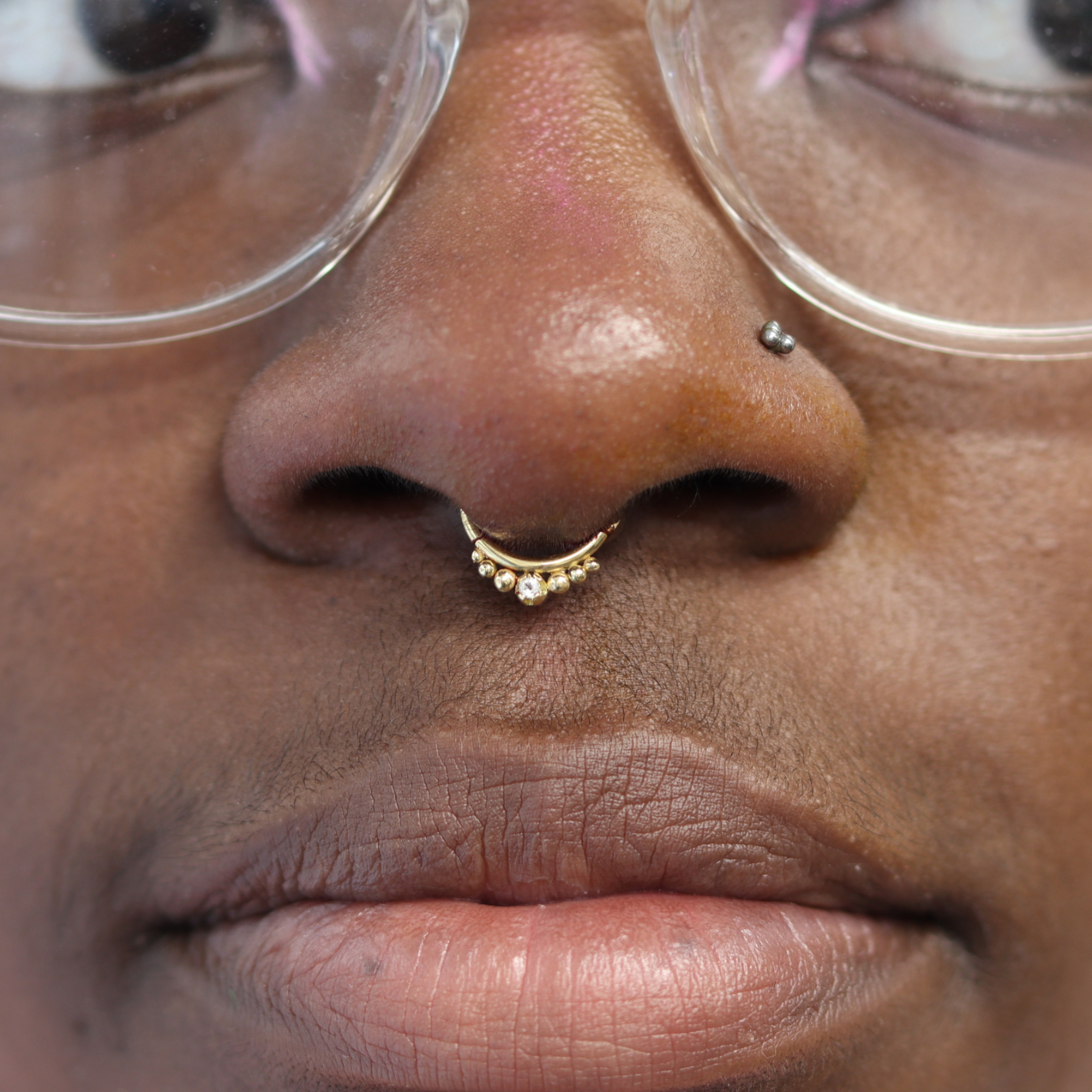 Septum piercing with Audition ring from Ixus fine jewellery