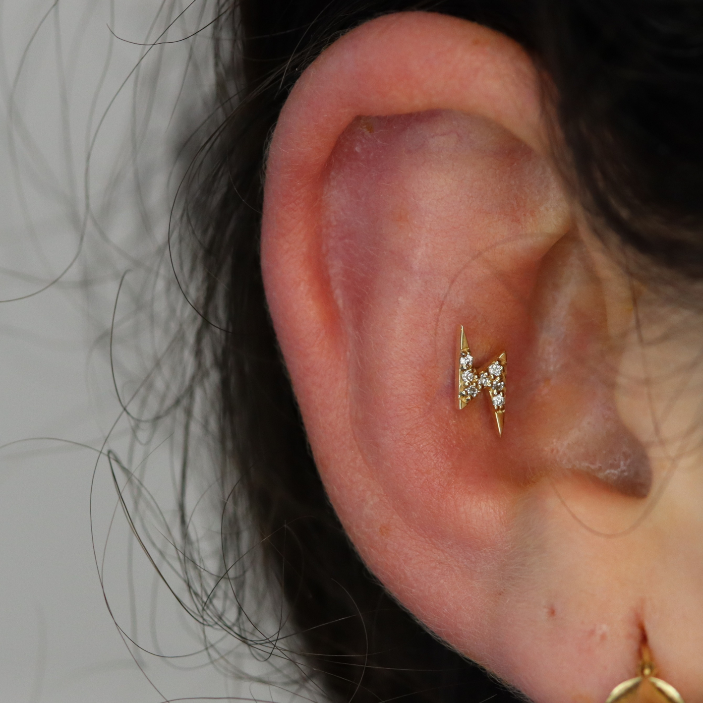 conch rim piercing with jewellery from BVLA