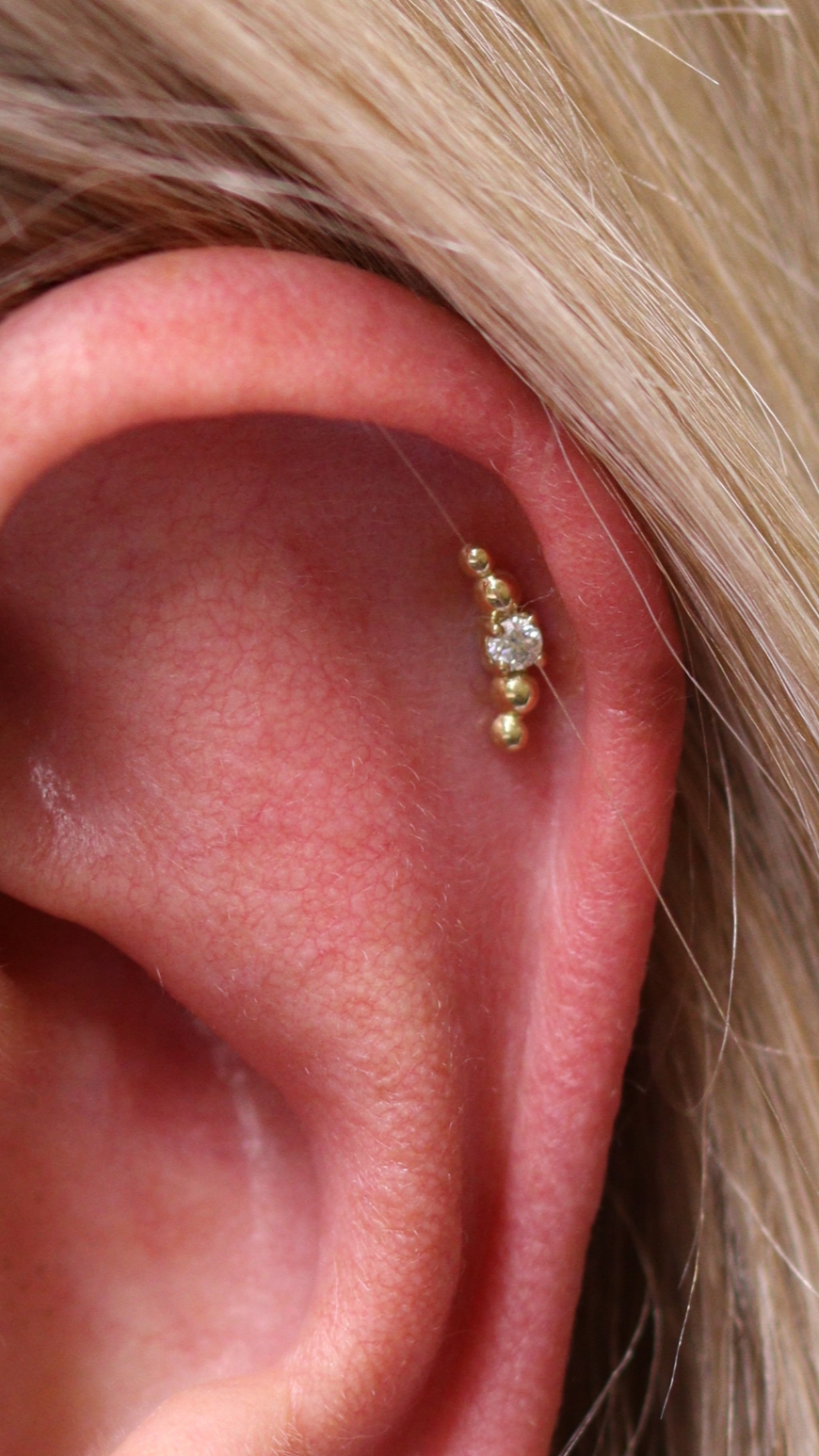 Helix piercing with 18k gold Companion end from Ixus Fine jewellery
