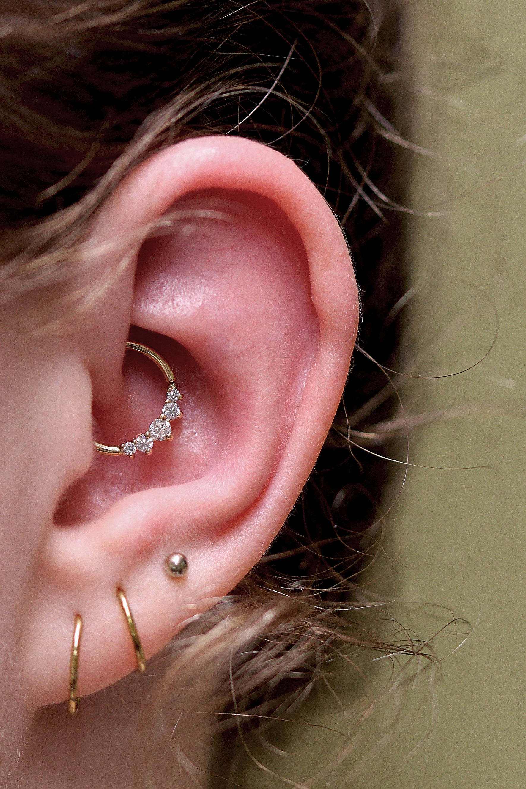 daith piercing with 18k yellow gold and moissanite Valentine ring from Ixus Fine Jewellery